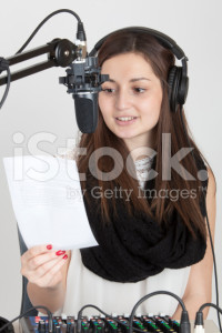 stock-photo-67346609-teen-with-headphones-on-a-sound-mixer-speaking-into-a-microphone